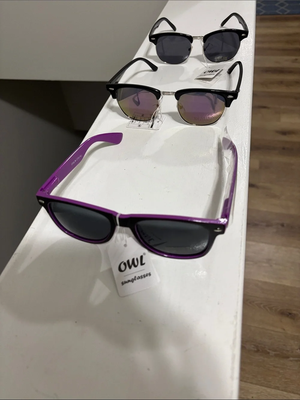 3 pair owl sunglasses with tags.